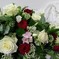 Rose and freesia casket spray