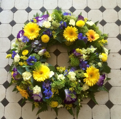 Delicate seasonal wreath in lemons mauve a blues