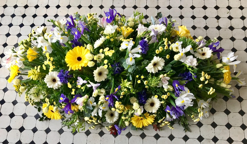 Gerbera and seasonal selection casket spray