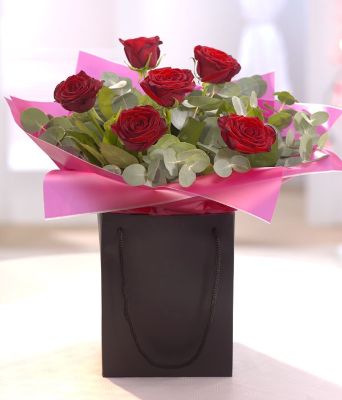 09.   6 Red Roses handtied