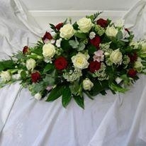 Rose and freesia casket spray