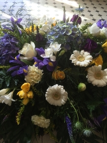 Casket spray in lemons blues and whites