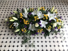 Lily and rose casket spray white purple and yellow